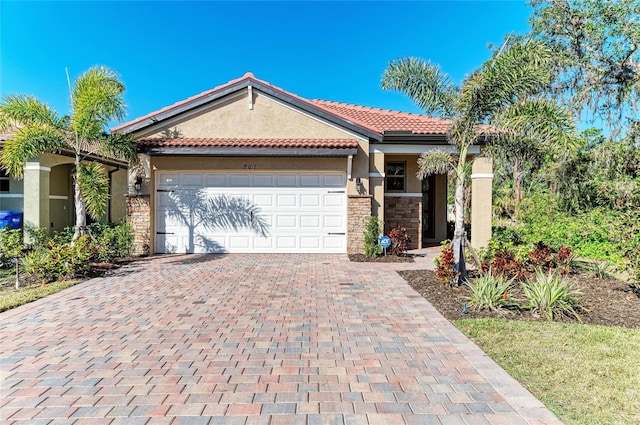 view of front of property with a garage