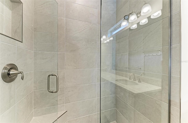 bathroom with a shower with shower door