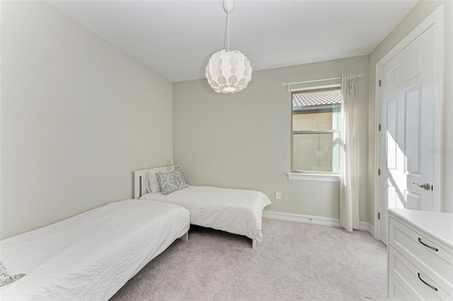 bedroom featuring light carpet