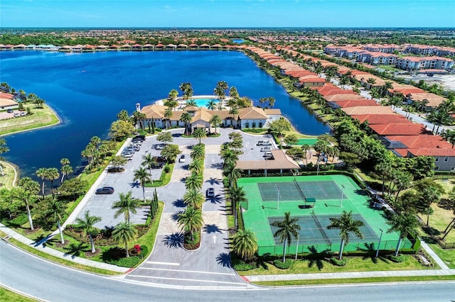 birds eye view of property with a water view