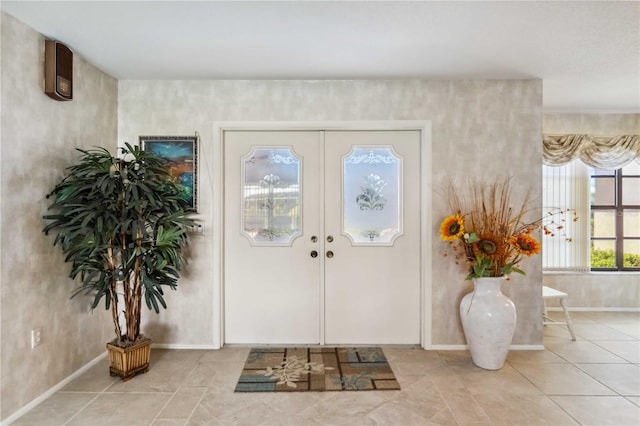 534 Warwick Ln, Venice, FL 34293 - entrance foyer featuring light tile patterned floors, french doors, and baseboards