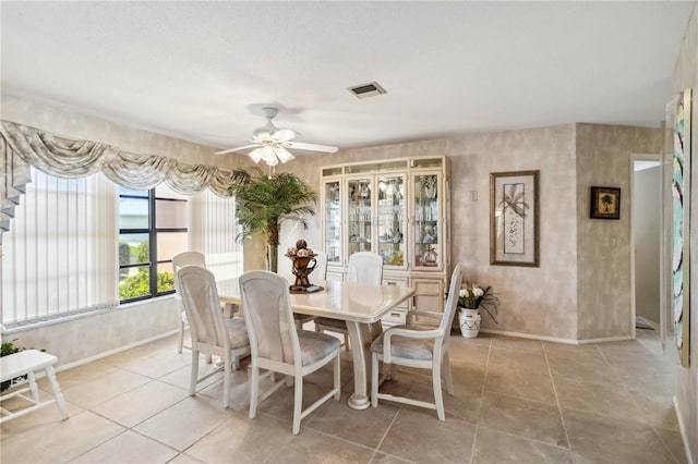 534 Warwick Ln, Venice, FL 34293 - dining space with ceiling fan, light tile patterned flooring, visible vents, and baseboards