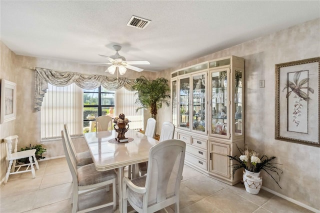 534 Warwick Ln, Venice, FL 34293 - dining room with light tile patterned floors, a textured ceiling, and visible vents