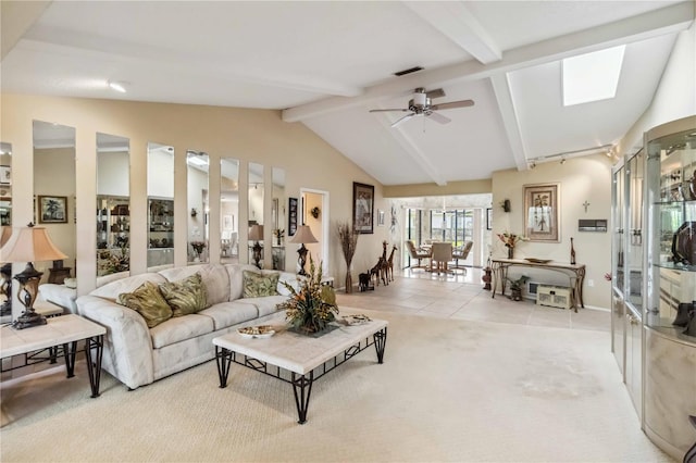 534 Warwick Ln, Venice, FL 34293 - living area featuring lofted ceiling with beams, ceiling fan, light tile patterned floors, light carpet, and visible vents