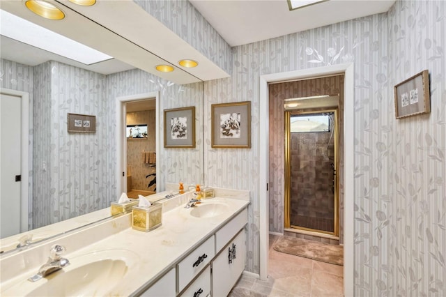 534 Warwick Ln, Venice, FL 34293 - bathroom with double vanity, tile patterned flooring, a sink, and wallpapered walls