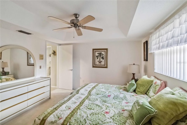 534 Warwick Ln, Venice, FL 34293 - bedroom featuring carpet floors, a raised ceiling, visible vents, and a ceiling fan