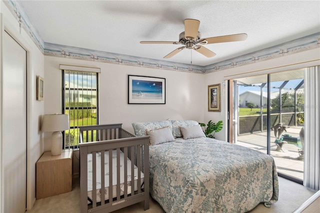 534 Warwick Ln, Venice, FL 34293 - carpeted bedroom featuring a sunroom, access to outside, multiple windows, and ceiling fan