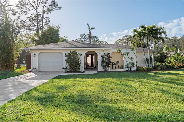 view of front of house featuring a garage and a front yard