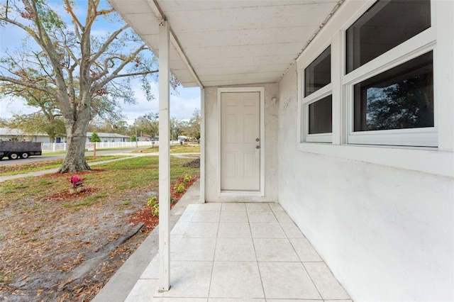 view of exterior entry with stucco siding