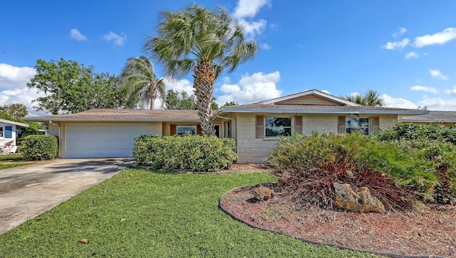 ranch-style home with a garage and a front yard