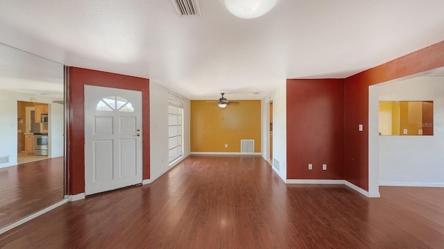 foyer entrance featuring dark hardwood / wood-style floors and ceiling fan