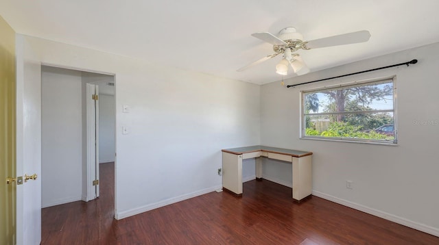 empty room featuring dark hardwood / wood-style floors and ceiling fan