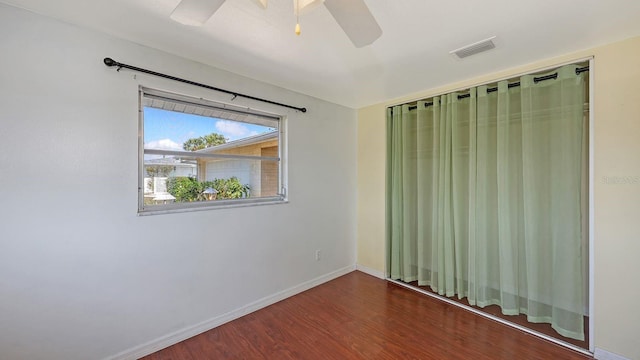 unfurnished room with dark hardwood / wood-style floors