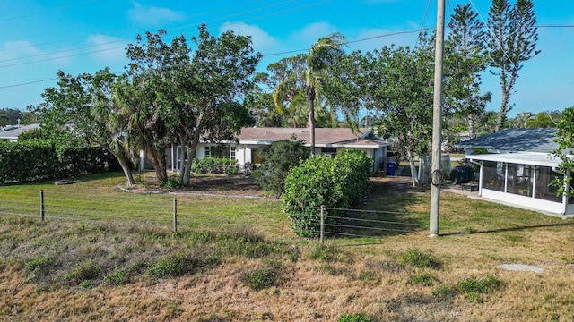 view of yard featuring a sunroom