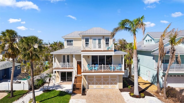 view of front of house featuring covered porch and a garage