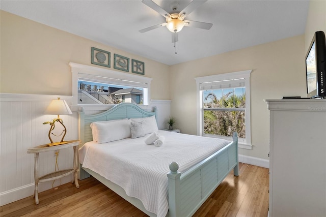 bedroom with hardwood / wood-style flooring and ceiling fan