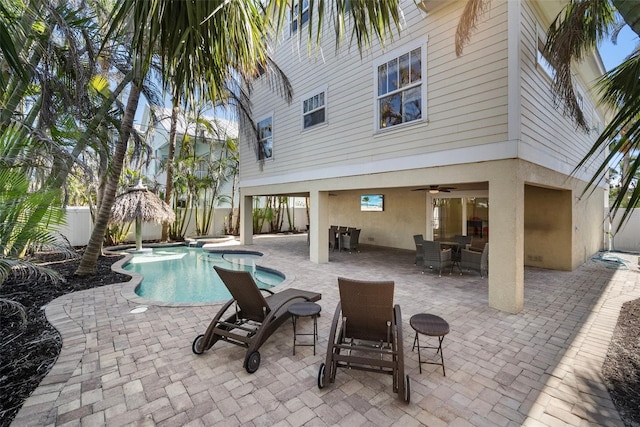 view of pool featuring a patio and ceiling fan