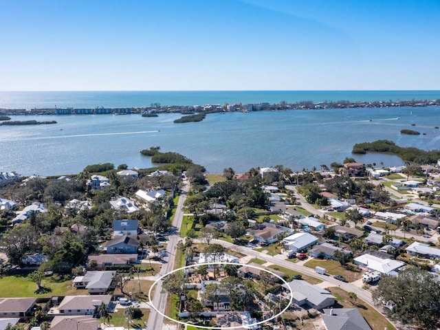 birds eye view of property with a water view and a residential view