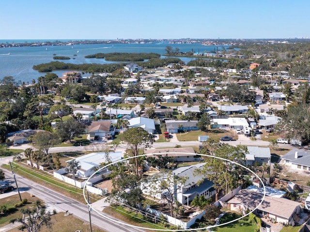 bird's eye view featuring a water view and a residential view