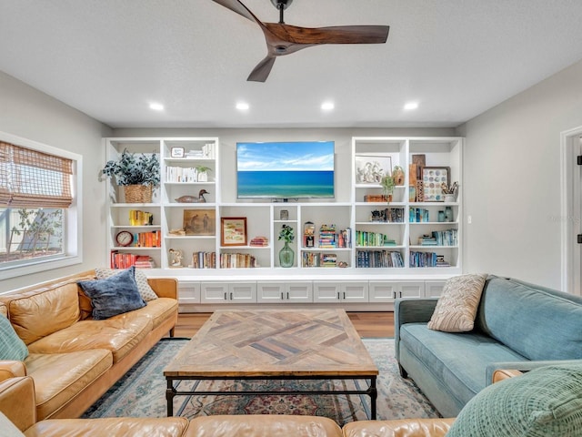 living area featuring a textured ceiling, wood finished floors, a ceiling fan, and recessed lighting