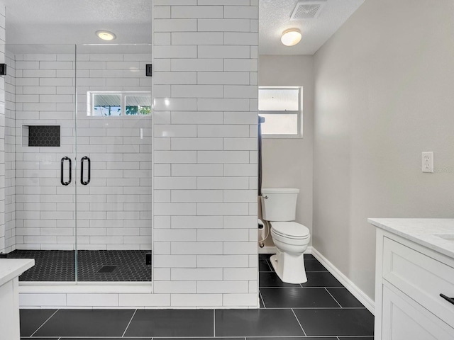 bathroom featuring toilet, tile patterned flooring, visible vents, and vanity