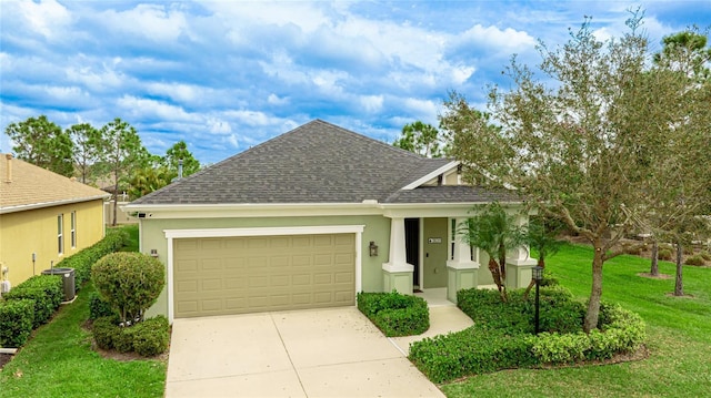 view of front of house featuring central air condition unit, a shingled roof, stucco siding, an attached garage, and driveway