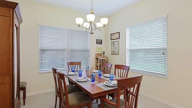 3839 Autumn Fern Ter, Sarasota, FL 34243 - dining space with a chandelier, baseboards, and light tile patterned floors