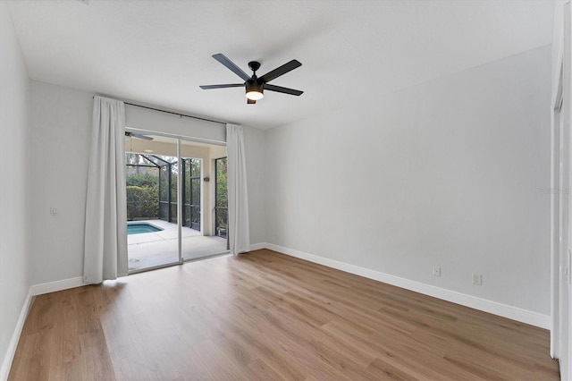 unfurnished room featuring light hardwood / wood-style flooring and ceiling fan