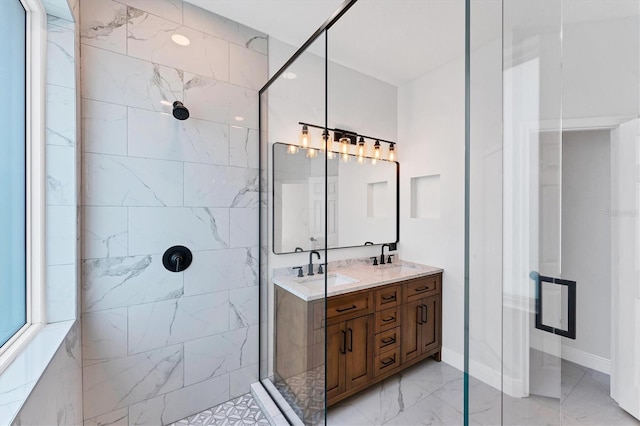 bathroom with vanity and a shower with shower door