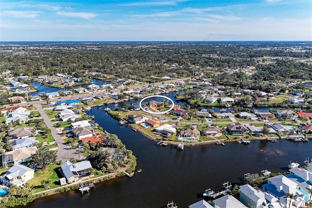 drone / aerial view featuring a water view and a residential view