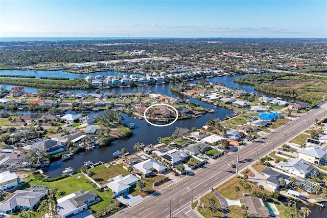 birds eye view of property featuring a water view and a residential view