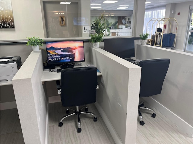 home office with wood finished floors and baseboards