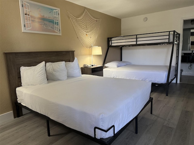 7150 N Tamiami Trl Unit S510, Sarasota, FL 34243 - bedroom featuring wood finished floors