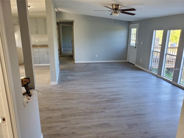 unfurnished living room featuring light hardwood / wood-style floors and ceiling fan