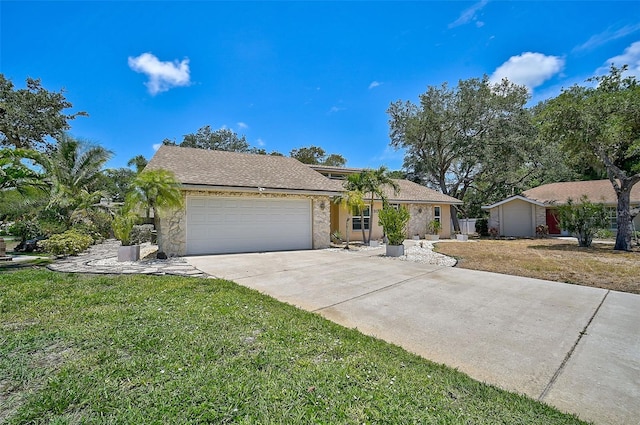 single story home featuring a front lawn and a garage