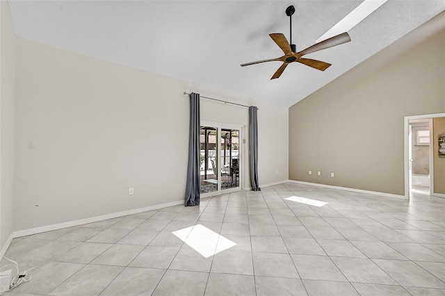 spare room with high vaulted ceiling, light tile patterned flooring, and ceiling fan