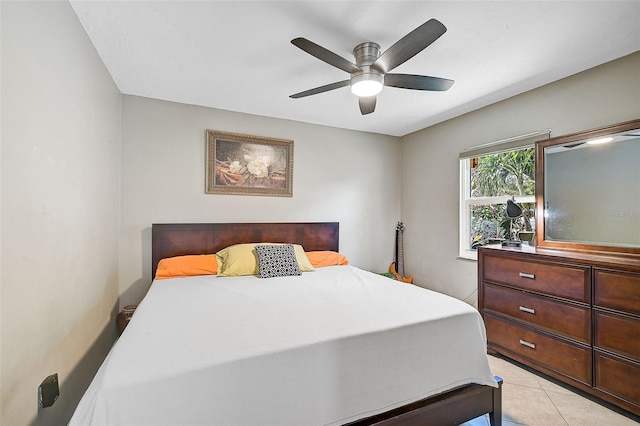 tiled bedroom with ceiling fan