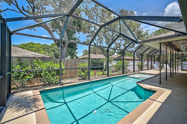 view of pool featuring a patio and a lanai