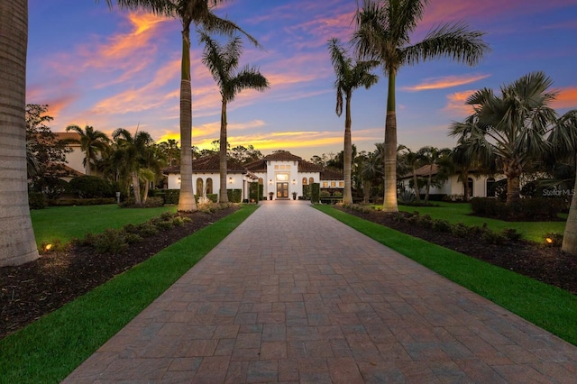 mediterranean / spanish-style home featuring a yard