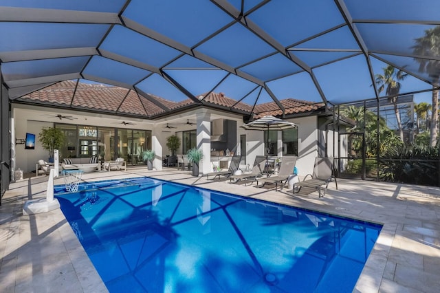 19424 Ganton Ave, Lakewood Ranch, FL 34202 - back of house with a ceiling fan, a tile roof, a patio area, and an outdoor pool