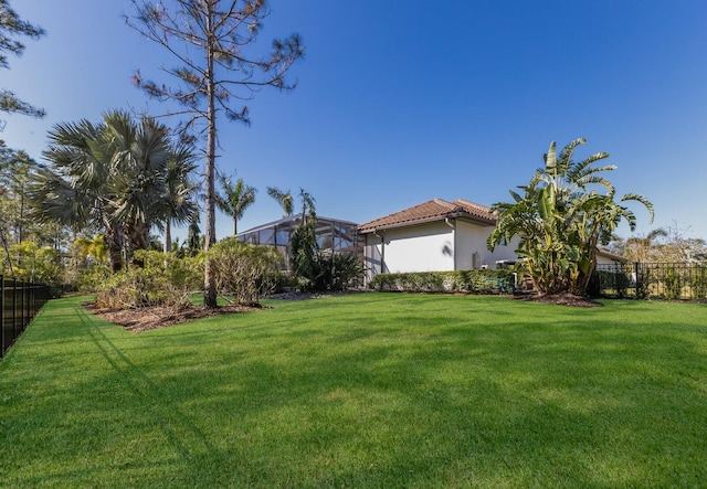 19424 Ganton Ave, Lakewood Ranch, FL 34202 - view of yard with glass enclosure and fence