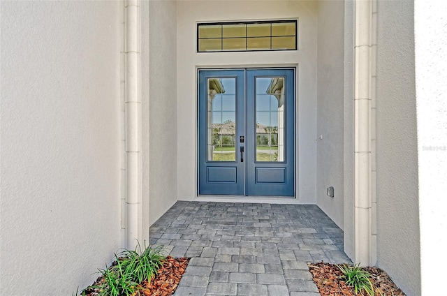 552 Bocelli Dr, North Venice, FL 34275 - entrance to property with french doors and stucco siding