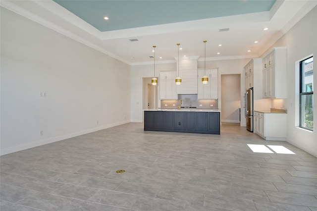552 Bocelli Dr, North Venice, FL 34275 - kitchen with open floor plan, white cabinets, light countertops, and freestanding refrigerator