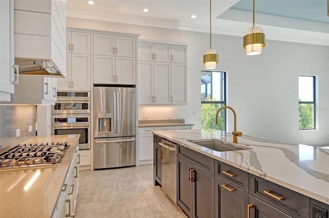 552 Bocelli Dr, North Venice, FL 34275 - kitchen with white cabinetry, plenty of natural light, appliances with stainless steel finishes, and a sink
