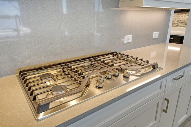 552 Bocelli Dr, North Venice, FL 34275 - interior details with light countertops, stainless steel gas stovetop, and white cabinets
