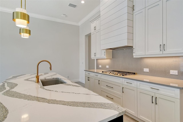 552 Bocelli Dr, North Venice, FL 34275 - kitchen featuring tasteful backsplash, visible vents, crown molding, stainless steel gas stovetop, and a sink