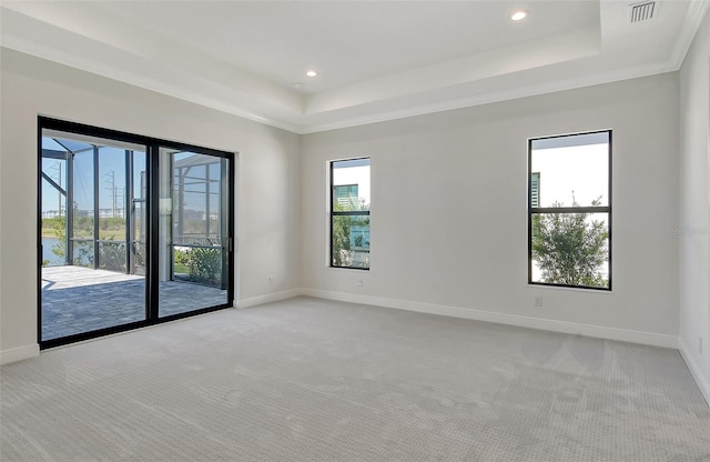 552 Bocelli Dr, North Venice, FL 34275 - unfurnished room with a tray ceiling, baseboards, and visible vents