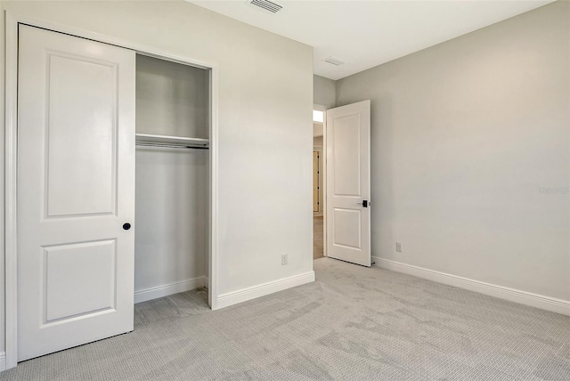 552 Bocelli Dr, North Venice, FL 34275 - unfurnished bedroom with a closet, baseboards, light colored carpet, and visible vents