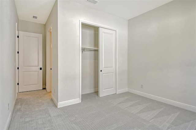 552 Bocelli Dr, North Venice, FL 34275 - unfurnished bedroom with light carpet, visible vents, baseboards, and a closet