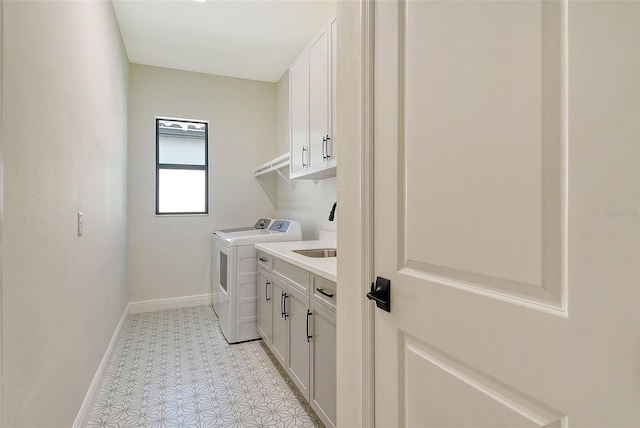 552 Bocelli Dr, North Venice, FL 34275 - laundry room featuring cabinet space, baseboards, and washer and clothes dryer